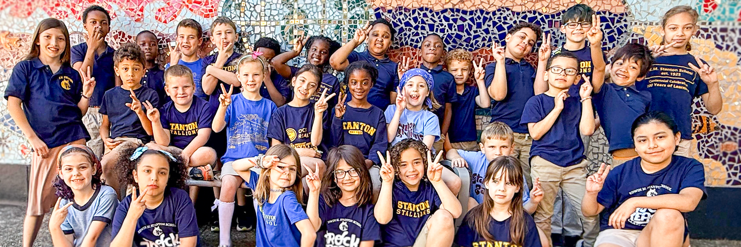 Students and staff at Edwin M. Stanton School participate in orchestra, classroom activities, arts programming, and community-centered learning experiences.